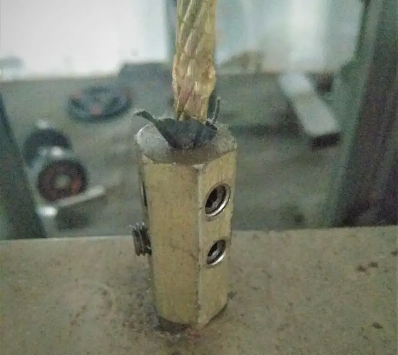 Frayed cable on a gym equipment.
