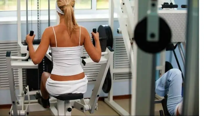 Image of a woman using a multi-gym