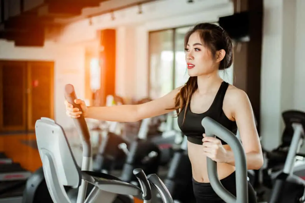 Image of a woman working out on an elliptical trainer