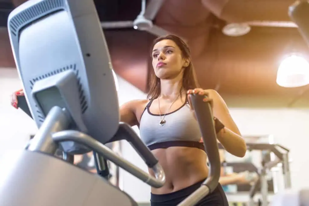 Image of a woman using an elliptical trainer
