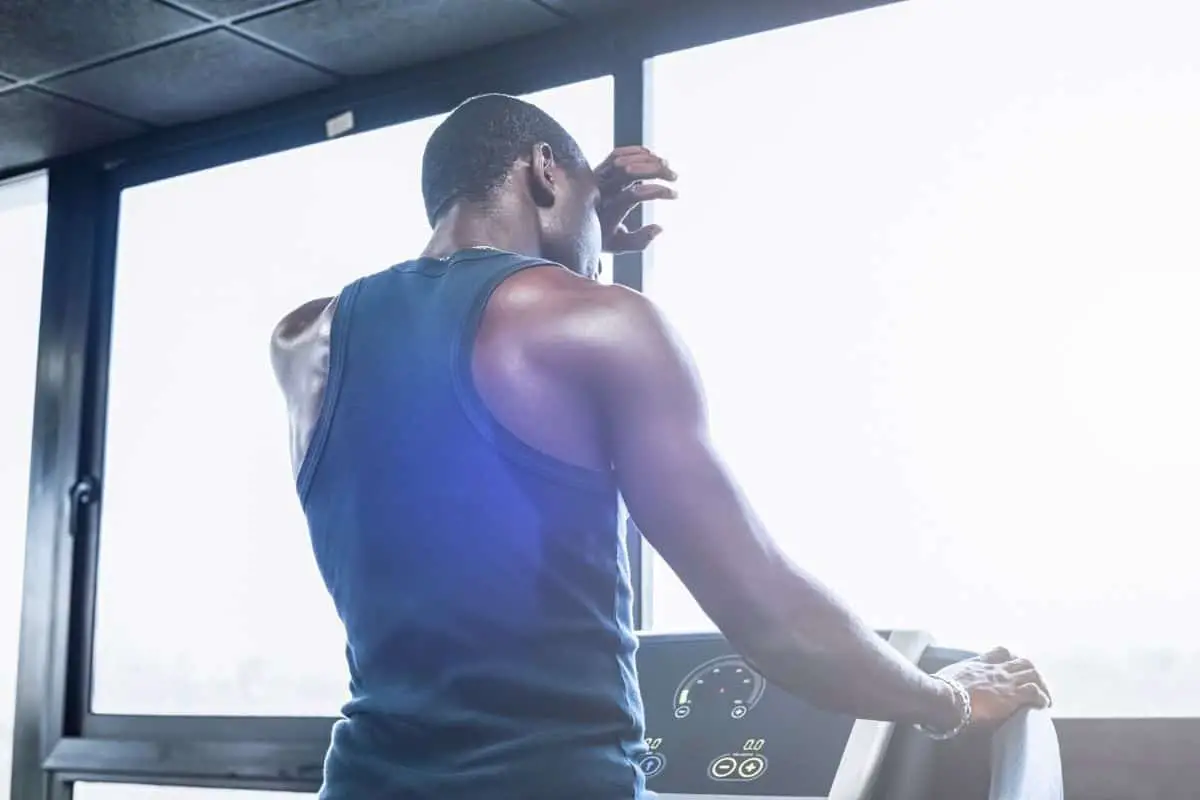 Image of a man sweating on a treadmill.