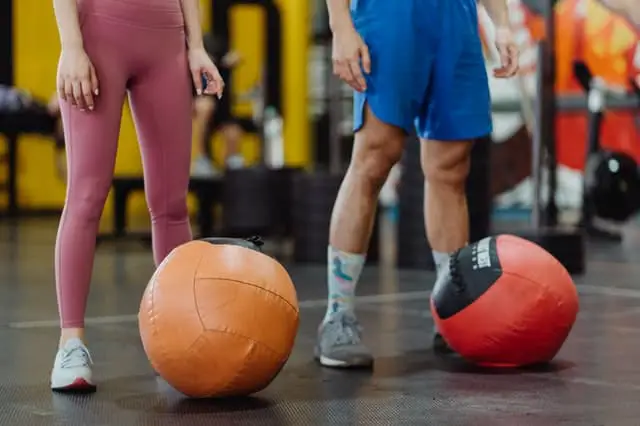 Image of people standing in front of medicine balls.