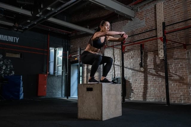 Image of a woman jumping on a plyo box