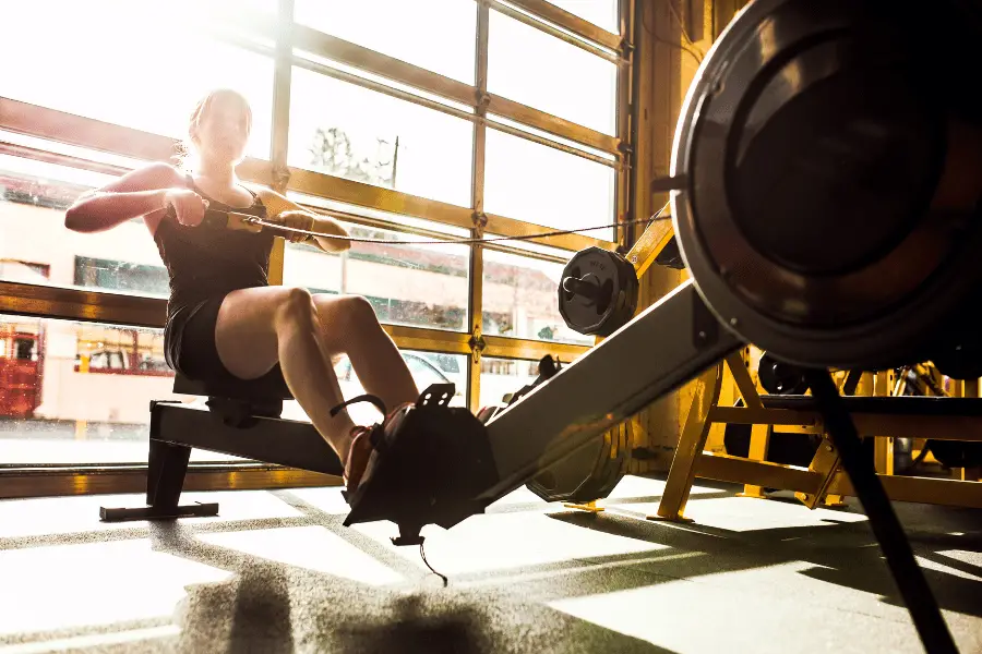 Image of a woman rowing on a rowing machine