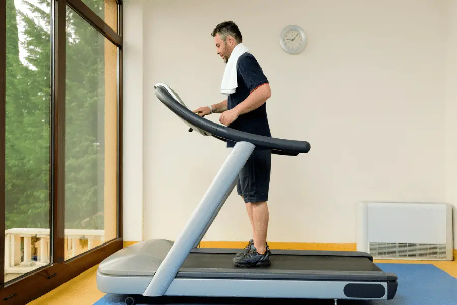 A treadmill on a rubber mat.