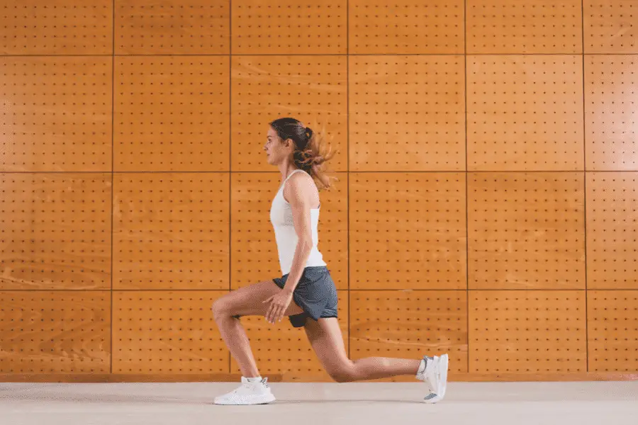Image of a woman doing walking lunges
