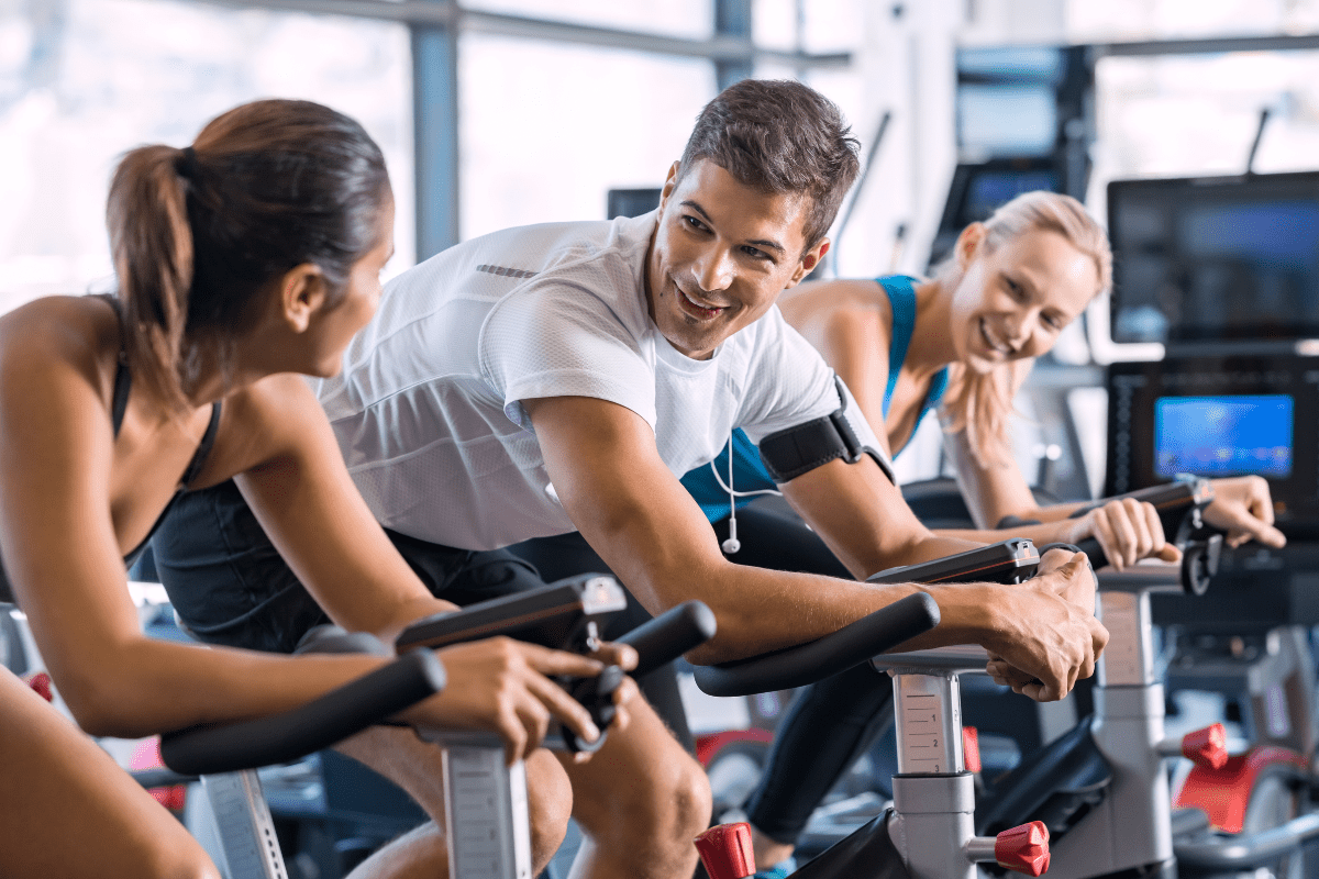 Image of people talking during a spin class.