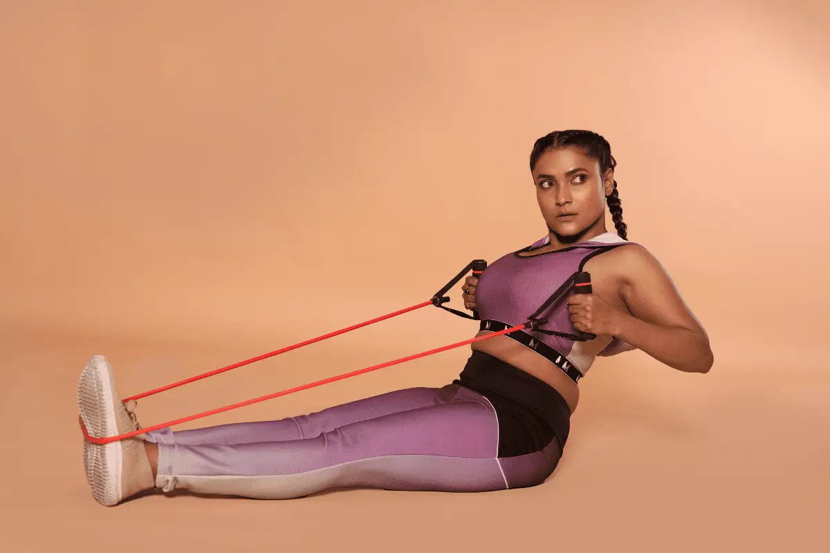 Image of a woman using resistance bands to exercise.