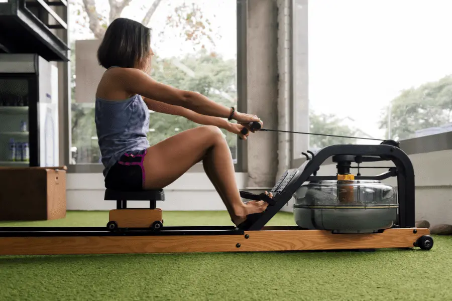 Image of a woman using a stationary rowing machine